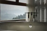 Elegante Badewanne mit modernem Wasserhahn, malerischer Ausblick aus dem Fenster